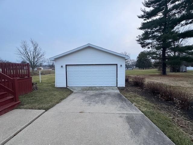 garage with a lawn