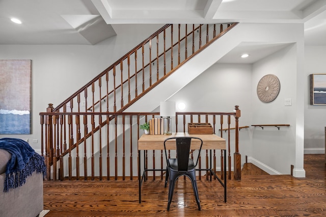 stairway with hardwood / wood-style floors