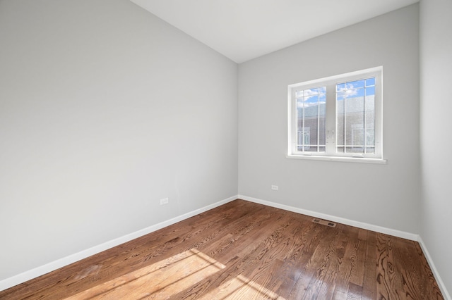 spare room featuring hardwood / wood-style floors