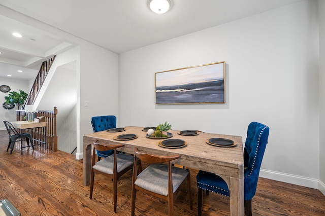 dining area with dark hardwood / wood-style flooring