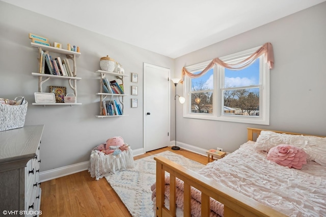 bedroom with light hardwood / wood-style floors