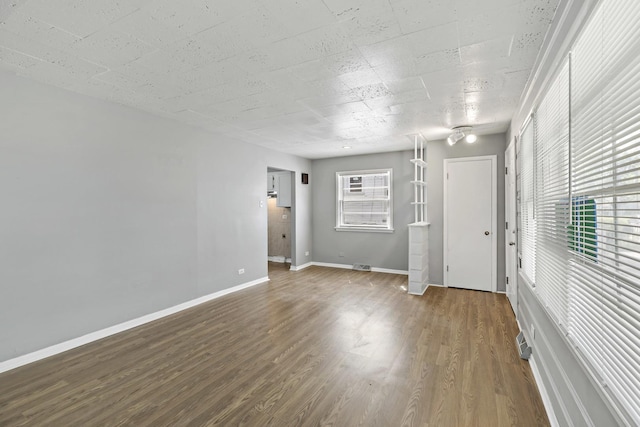 unfurnished room featuring wood-type flooring