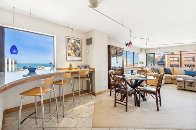 dining space featuring a water view