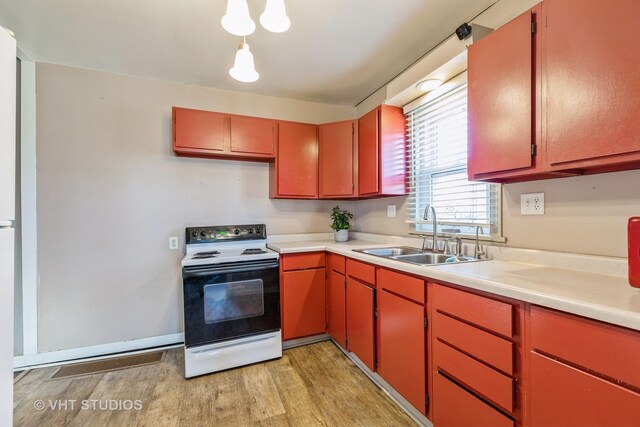 kitchen with range with electric stovetop and sink