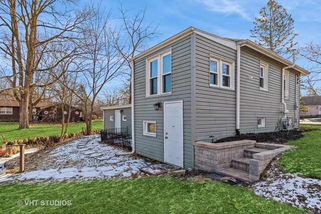 rear view of house with a lawn