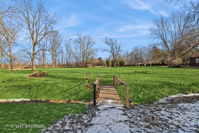 view of yard with a rural view