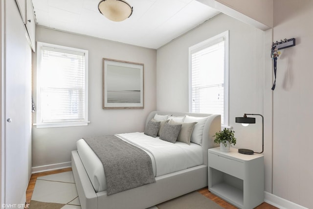 bedroom with light wood-type flooring