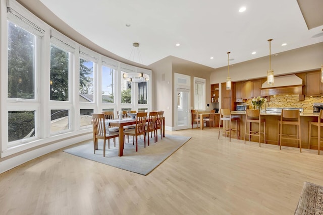 dining area with light hardwood / wood-style floors