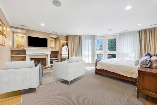 bedroom featuring light colored carpet and crown molding