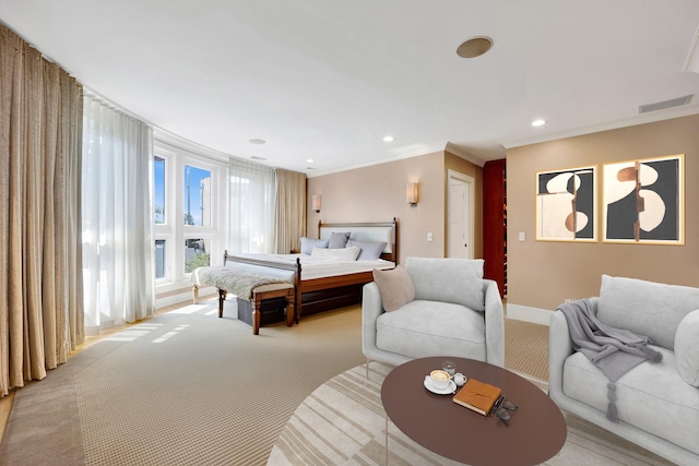 carpeted bedroom featuring crown molding