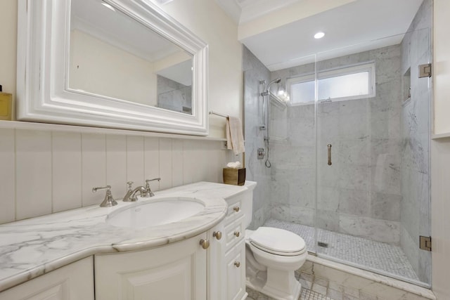 bathroom with vanity, toilet, an enclosed shower, and ornamental molding