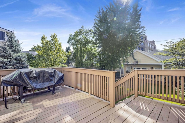 wooden deck featuring area for grilling