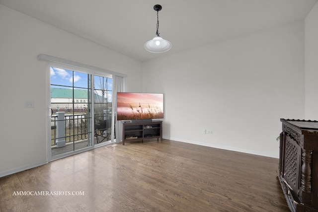 unfurnished living room with dark wood-type flooring