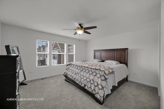 bedroom with light colored carpet and ceiling fan