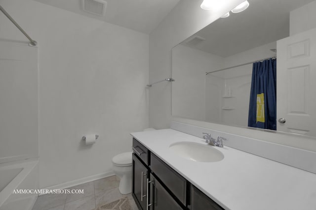 bathroom with vanity, tile patterned floors, and toilet