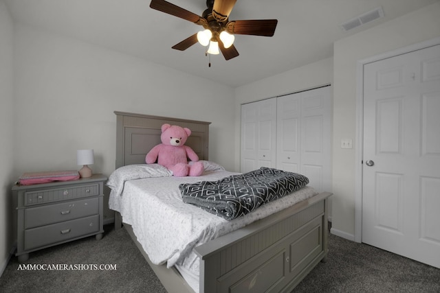 carpeted bedroom featuring ceiling fan and a closet