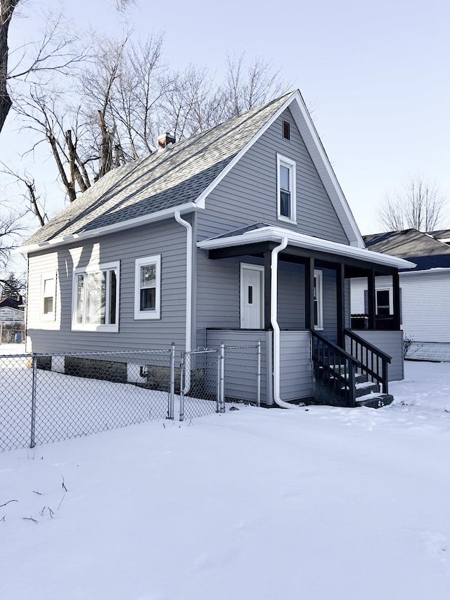 view of front of home with a garage and covered porch