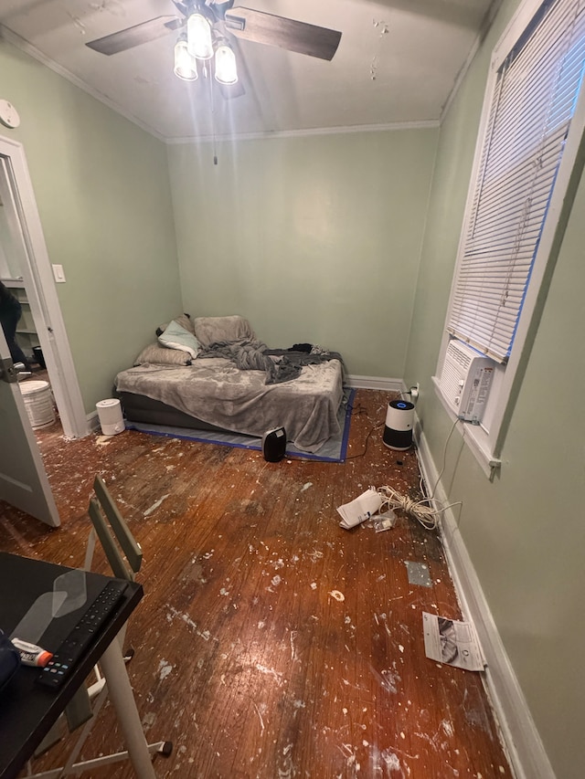 bedroom with ceiling fan, ornamental molding, cooling unit, and hardwood / wood-style flooring