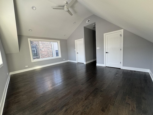 additional living space featuring dark hardwood / wood-style flooring, ceiling fan, and lofted ceiling