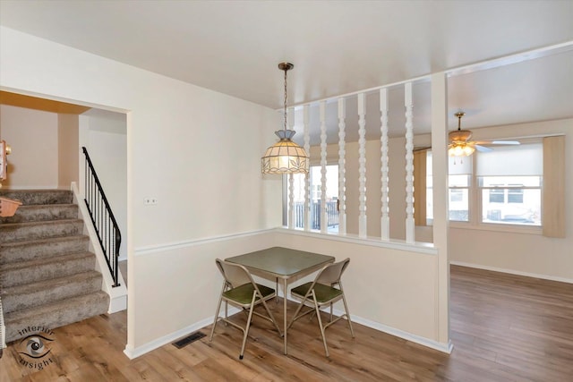 dining room featuring ceiling fan and hardwood / wood-style flooring