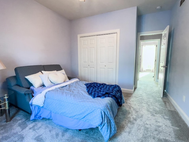 bedroom featuring a closet and carpet floors