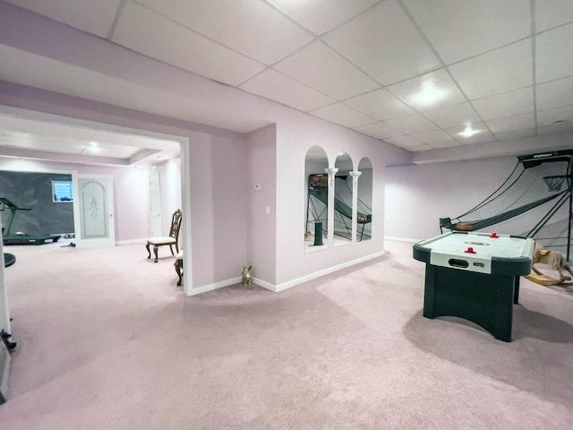 game room featuring a paneled ceiling and carpet