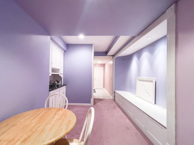 dining area with light colored carpet