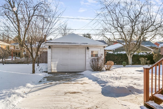 view of snow covered garage