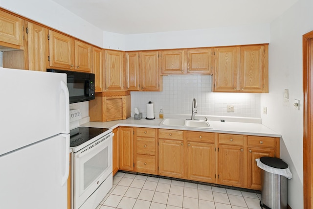 kitchen featuring tasteful backsplash, light tile patterned floors, sink, and white appliances