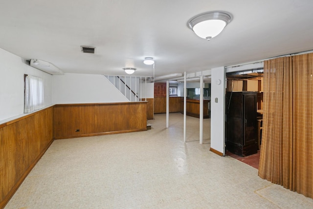 basement with wooden walls