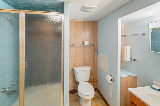 bathroom featuring walk in shower, vanity, and toilet