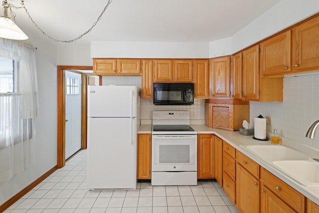 kitchen featuring light tile patterned flooring, sink, backsplash, and white appliances