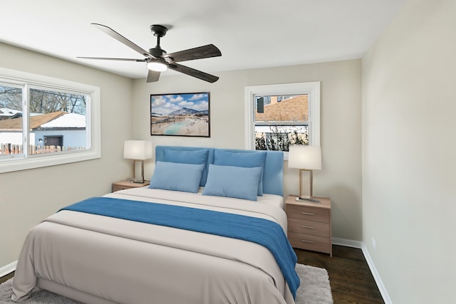 bedroom featuring ceiling fan and dark hardwood / wood-style floors