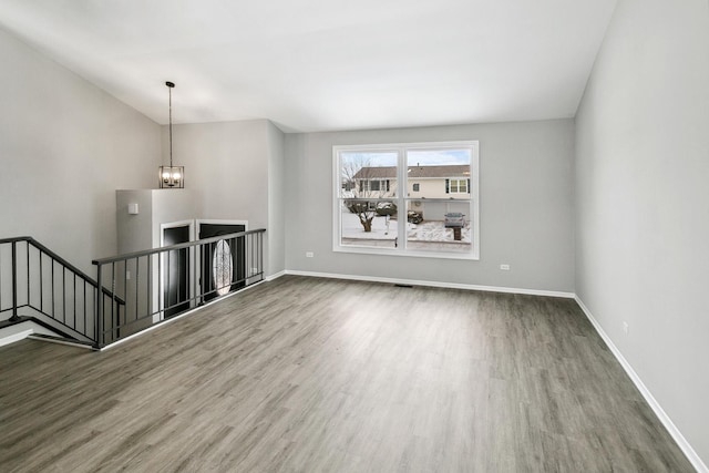 interior space with hardwood / wood-style flooring and a notable chandelier