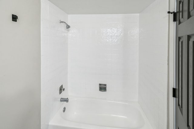 bathroom with bathing tub / shower combination