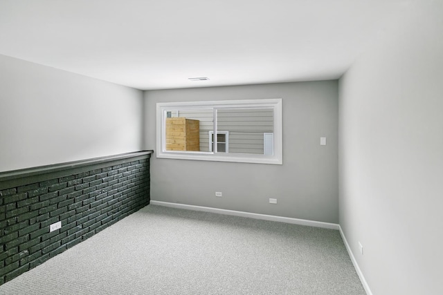 unfurnished room featuring carpet flooring