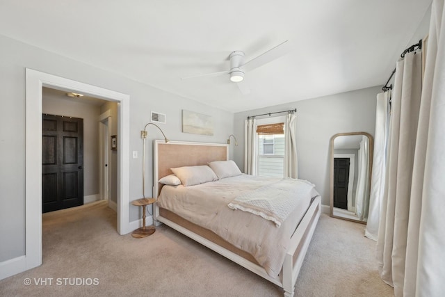 bedroom featuring ceiling fan and light colored carpet