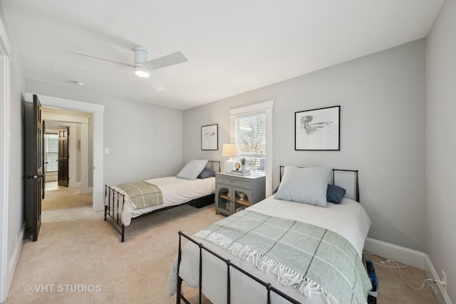 bedroom featuring ceiling fan and light colored carpet