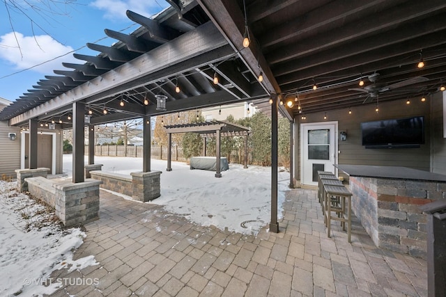 view of patio / terrace with an outdoor bar and a pergola