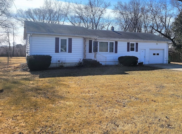 ranch-style home with a garage and a front yard