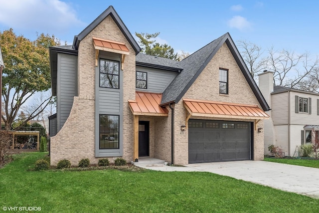 view of front of home featuring a front lawn and a garage