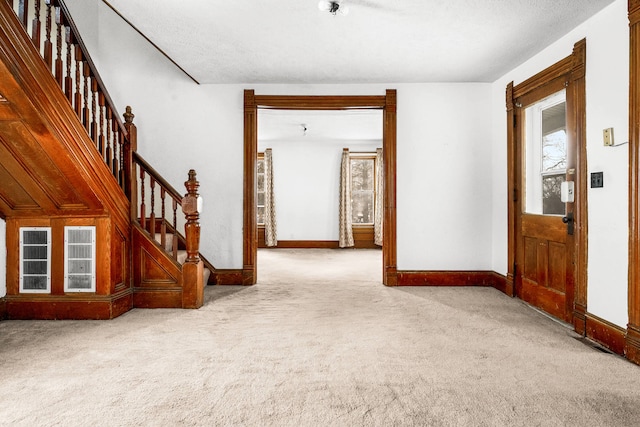 view of carpeted entrance foyer