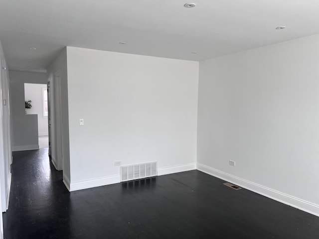 empty room featuring dark hardwood / wood-style floors