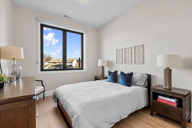 bedroom featuring hardwood / wood-style flooring