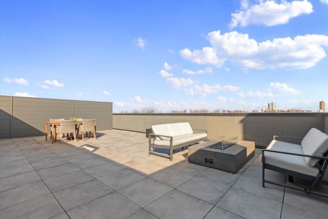 view of patio with an outdoor fire pit