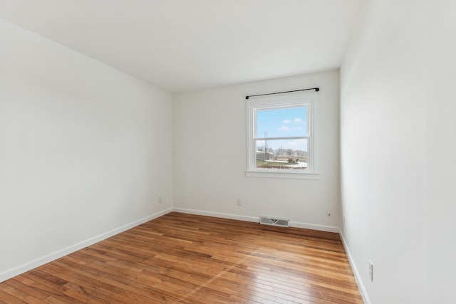 unfurnished room featuring light hardwood / wood-style flooring