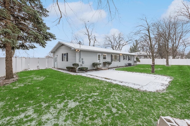 back of house with a yard and a patio