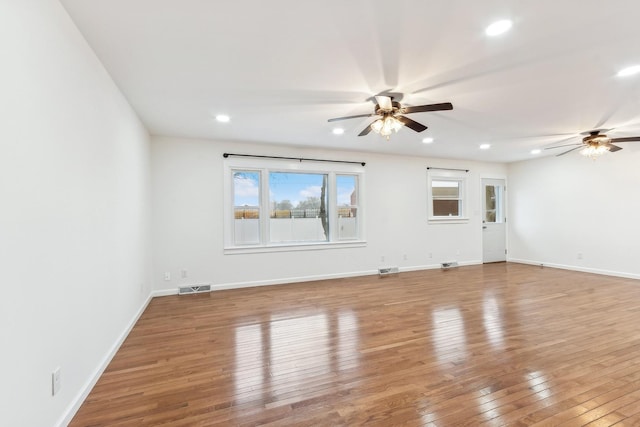 spare room featuring ceiling fan and wood-type flooring