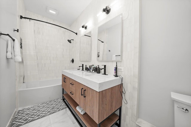 full bathroom with toilet, vanity, and tiled shower / bath combo