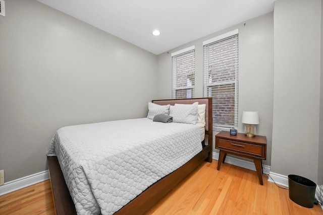 bedroom with hardwood / wood-style floors